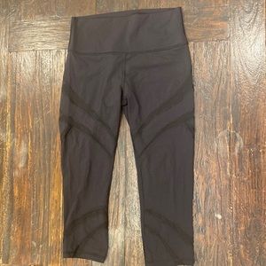 Lululemon Black High Rise Yoga Pant with Mesh Cutouts in a size 8